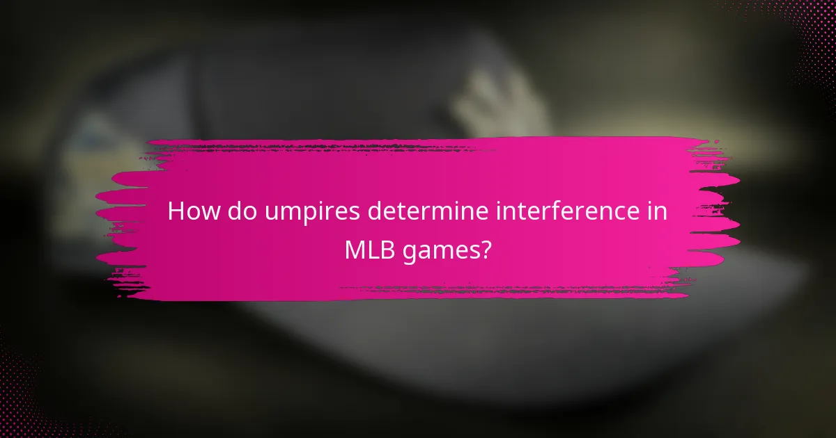 How do umpires determine interference in MLB games?