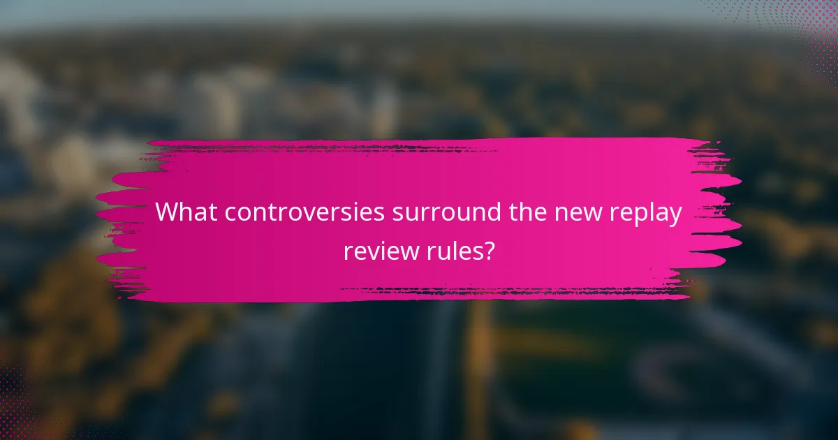 What controversies surround the new replay review rules?